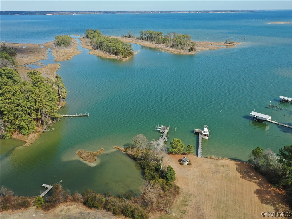 405 Locklies Creek Road Topping, VA 23169 - Photo 17 of 30 an aerial view of a house with a lake view
