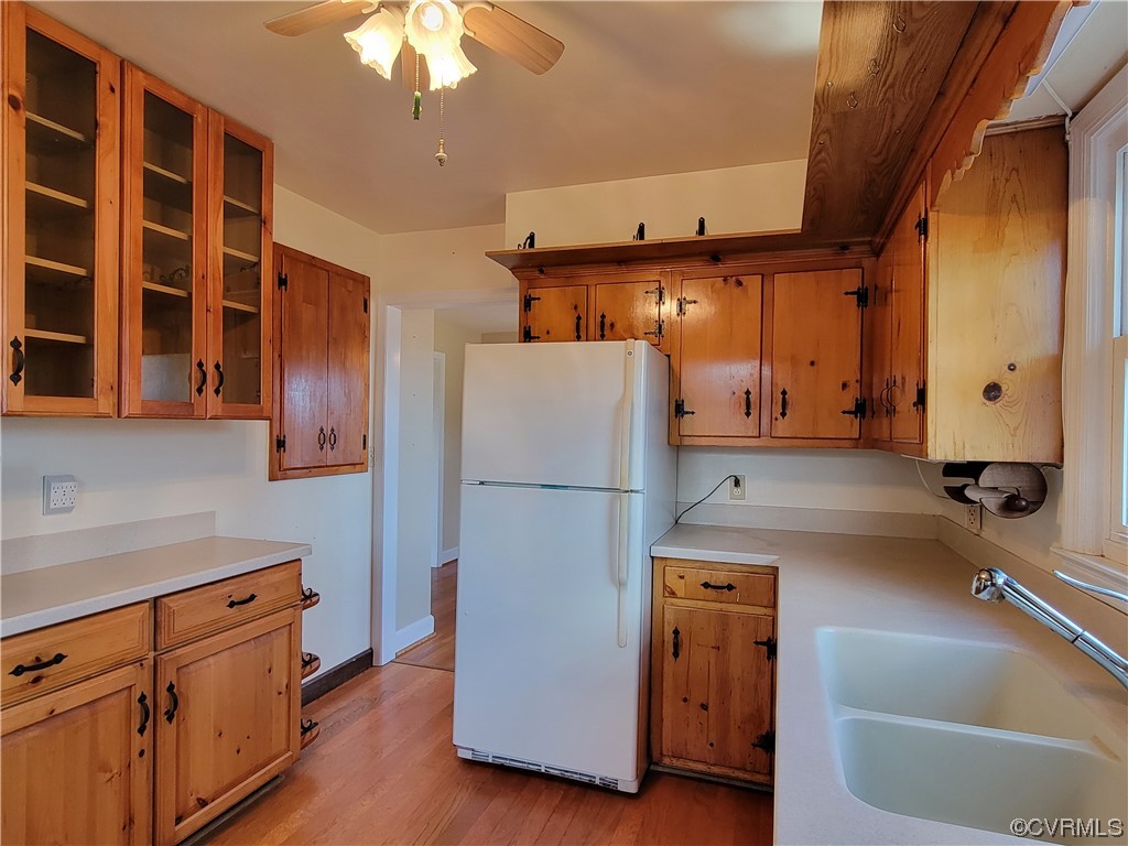 405 Locklies Creek Road Topping, VA 23169 - Photo 22 of 30 a kitchen with a refrigerator and a sink