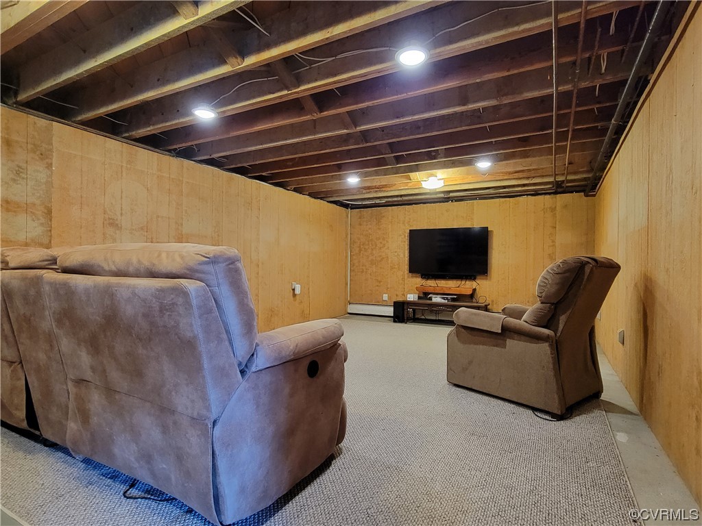 405 Locklies Creek Road Topping, VA 23169 - Photo 27 of 30 a living room with furniture and a flat screen tv