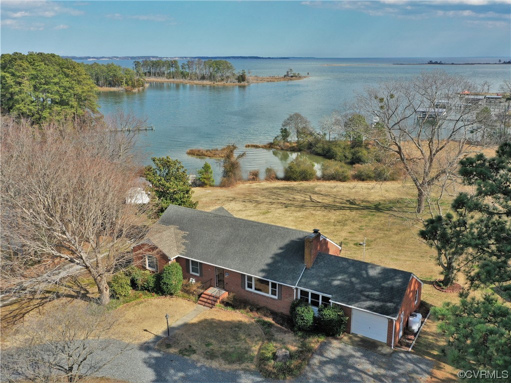 405 Locklies Creek Road Topping, VA 23169 - Photo 3 of 30 a view of a lake with a mountain in the background