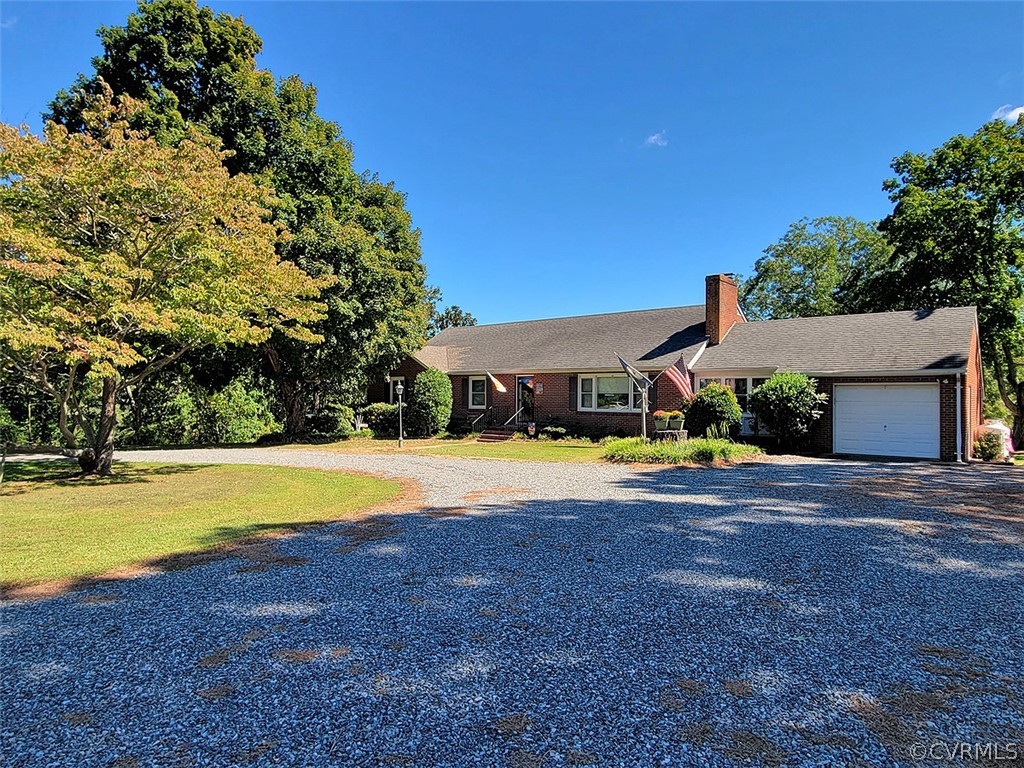 405 Locklies Creek Road Topping, VA 23169 - Photo 5 of 30 a view of a swimming pool with an outdoor space and seating area