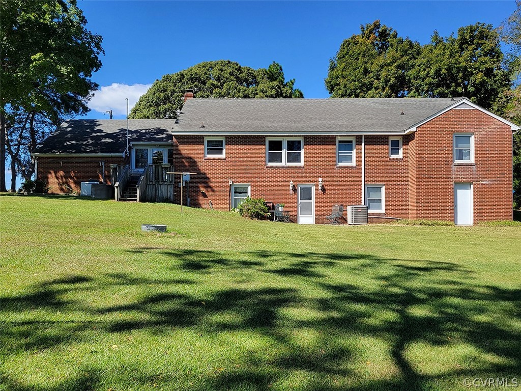 405 Locklies Creek Road Topping, VA 23169 - Photo 6 of 30 a front view of a house with a yard
