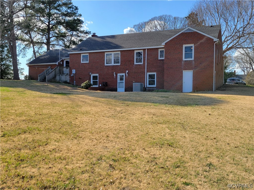 405 Locklies Creek Road Topping, VA 23169 - Photo 8 of 30 a front view of a house with a yard