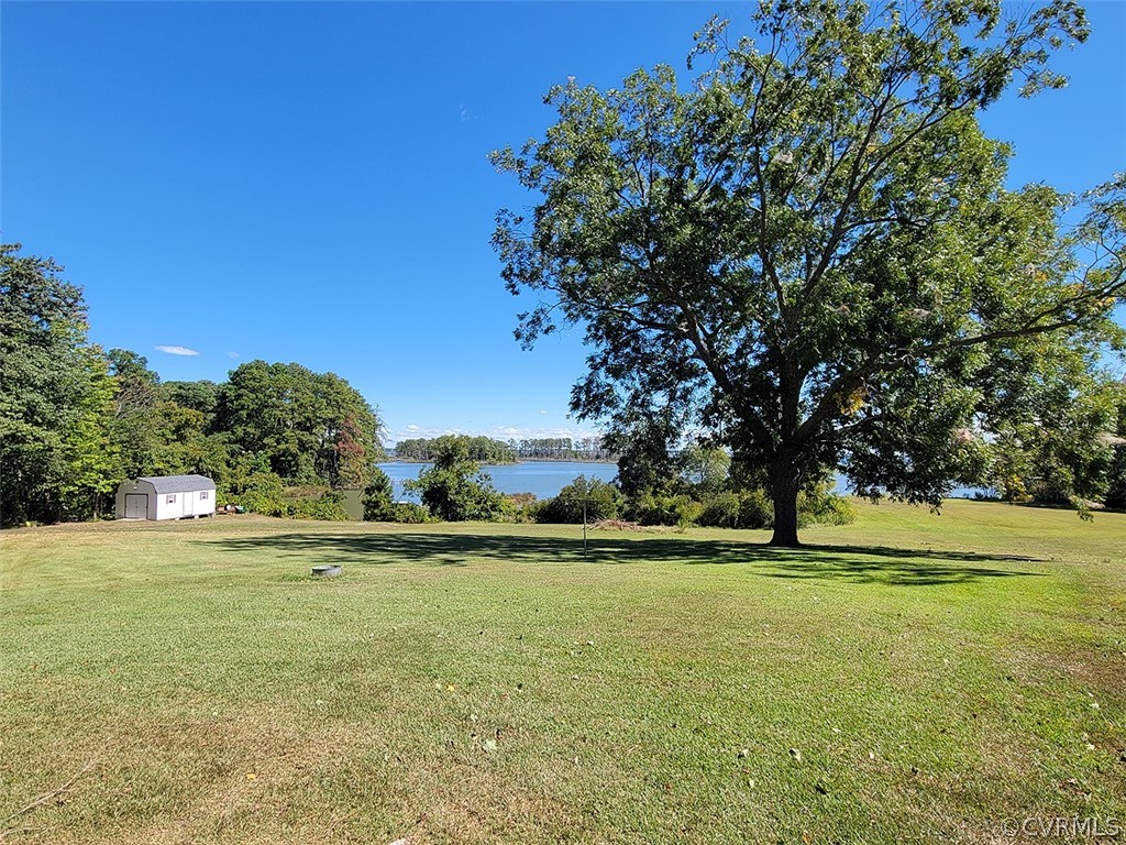 405 Locklies Creek Road Topping, VA 23169 - Photo 9 of 30 a view of a golf course with a trees