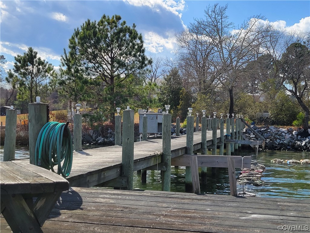 405 Locklies Creek Road Topping, VA 23169 - Photo 10 of 30 a view of a house with backyard and sitting area