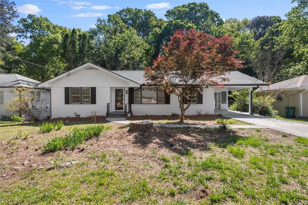 1130 Longshore Drive Decatur, GA 30032 - Photo 1 of 1 a front view of a house with a garden