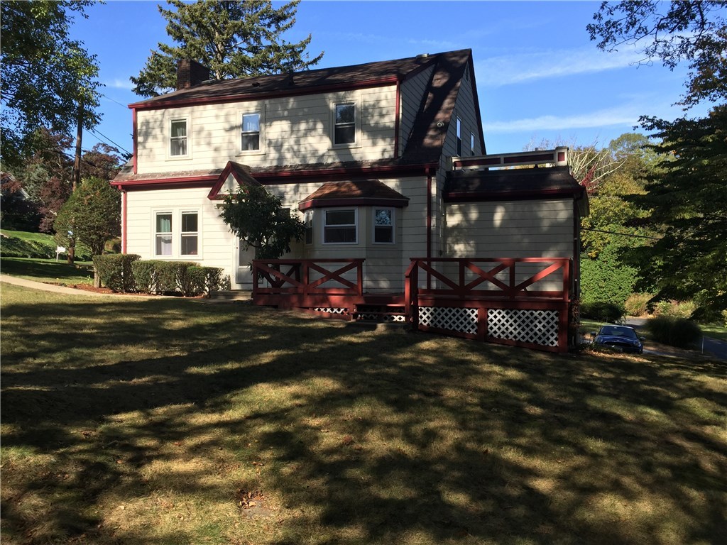 90 Progress Street Lincoln, RI 02865 - Photo 26 of 31 A Rear View Of The House Shows A Picturesque Setting With Mature Landscaping.