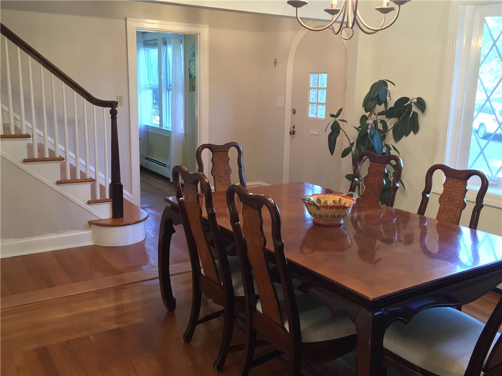 90 Progress Street Lincoln, RI 02865 - Photo 7 of 31 Another Perspective Of The Dining Room Shows The Open Layout Of The Home And The Exquisite Woodworking Of The Staircase.