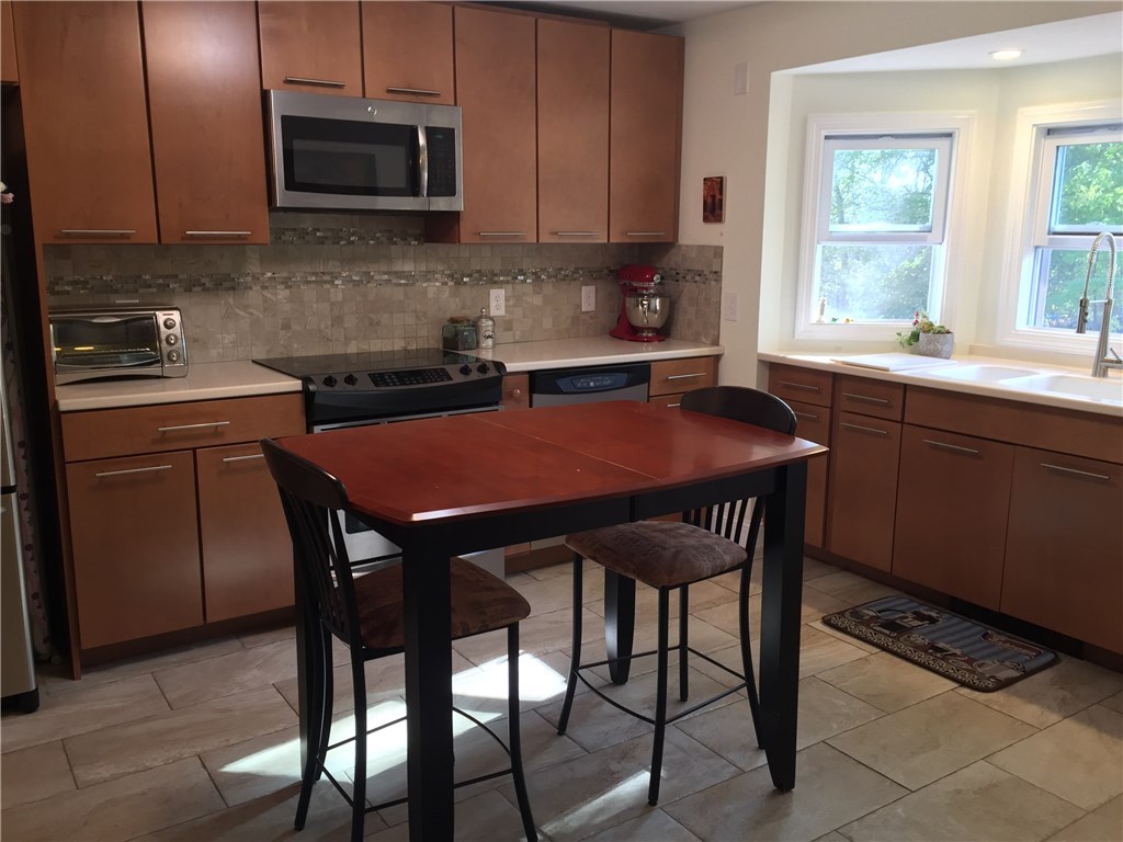 90 Progress Street Lincoln, RI 02865 - Photo 10 of 31 Remodeled And Redesigned, The Kitchen Is Modern And Has Tasteful, Neutral Colors.