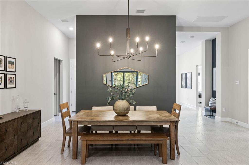 20734 Corkscrew Shores Boulevard Estero, FL 33928 - Photo 17 of 50 a dining room with furniture and window