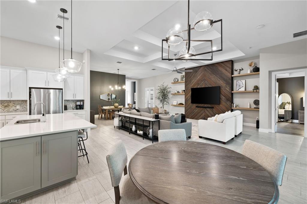20734 Corkscrew Shores Boulevard Estero, FL 33928 - Photo 19 of 50 a living room with fireplace furniture and a flat screen tv