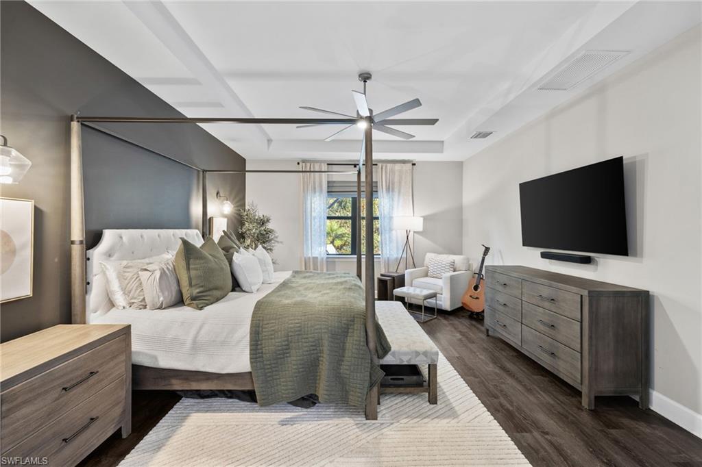 20734 Corkscrew Shores Boulevard Estero, FL 33928 - Photo 21 of 50 a bedroom with a bed and a flat screen tv