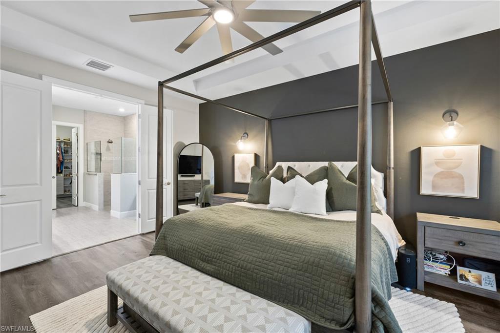 20734 Corkscrew Shores Boulevard Estero, FL 33928 - Photo 22 of 50 a bed room with a bed and a television