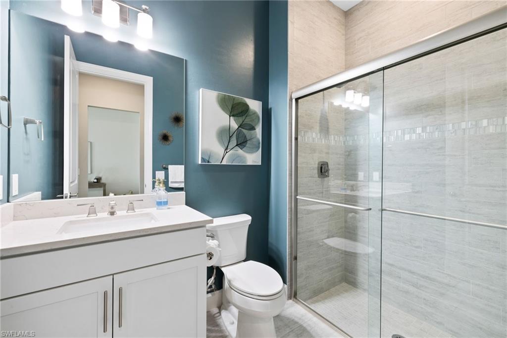 20734 Corkscrew Shores Boulevard Estero, FL 33928 - Photo 26 of 50 a bathroom with a sink toilet and shower