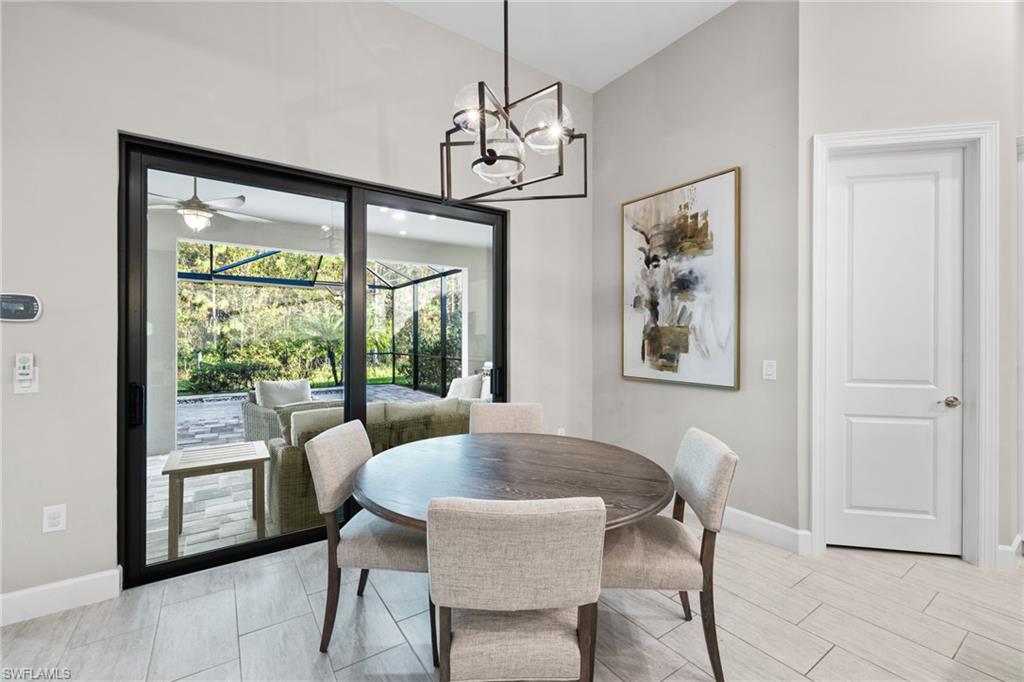 20734 Corkscrew Shores Boulevard Estero, FL 33928 - Photo 32 of 50 a dining room with furniture and window
