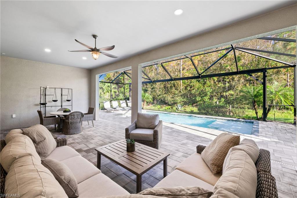 20734 Corkscrew Shores Boulevard Estero, FL 33928 - Photo 34 of 50 a living room with furniture and a large window