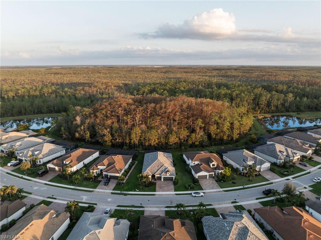20734 Corkscrew Shores Boulevard Estero, FL 33928 - Photo 38 of 50 an aerial view of residential building and lake
