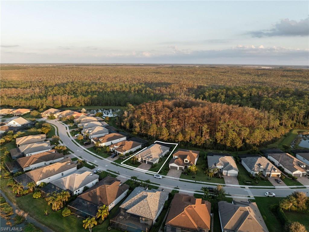 20734 Corkscrew Shores Boulevard Estero, FL 33928 - Photo 39 of 50 an aerial view of residential building and lake