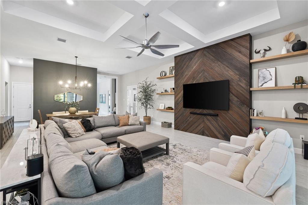 20734 Corkscrew Shores Boulevard Estero, FL 33928 - Photo 4 of 50 a living room with furniture and a flat screen tv