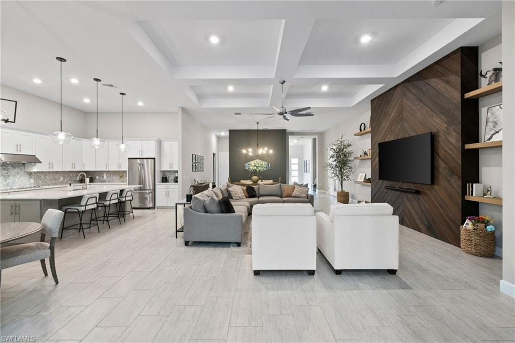 20734 Corkscrew Shores Boulevard Estero, FL 33928 - Photo 6 of 50 a living room with fireplace furniture and a flat screen tv