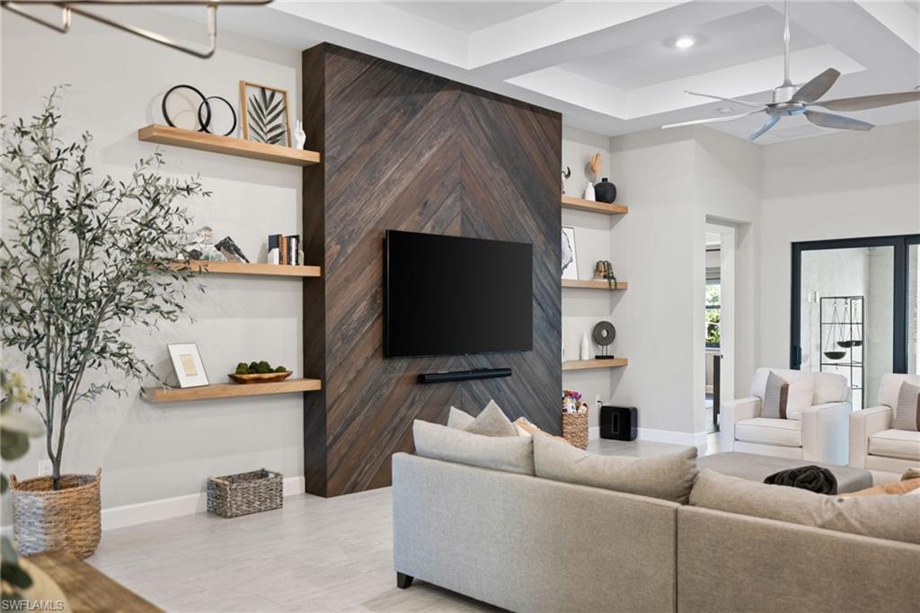 20734 Corkscrew Shores Boulevard Estero, FL 33928 - Photo 8 of 50 a living room with furniture and a flat screen tv