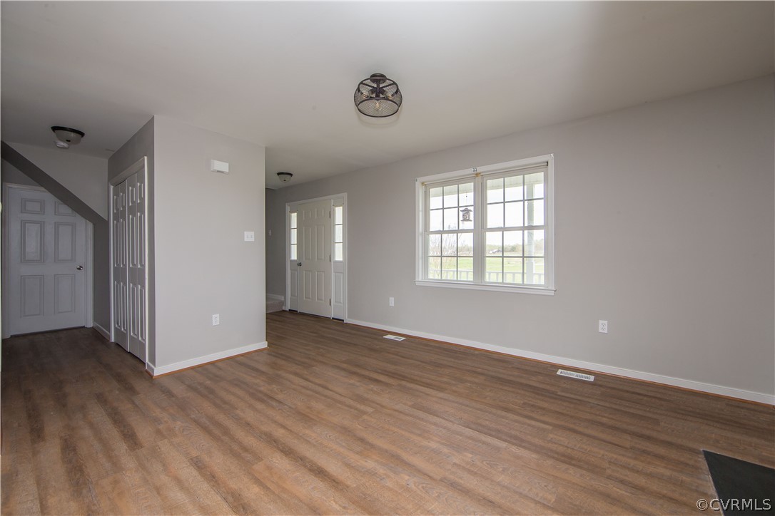 372 Davenport Road Cumberland, VA 23040 - Photo 5 of 36 Living room with new flooring, fixtures and paint.