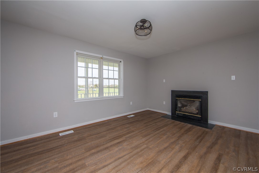 372 Davenport Road Cumberland, VA 23040 - Photo 6 of 36 Living room with new flooring, fixtures and paint.
