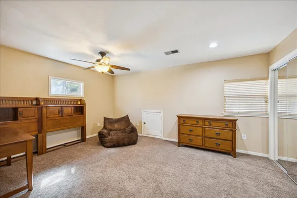 a view of workspace with a window and a ceiling fan