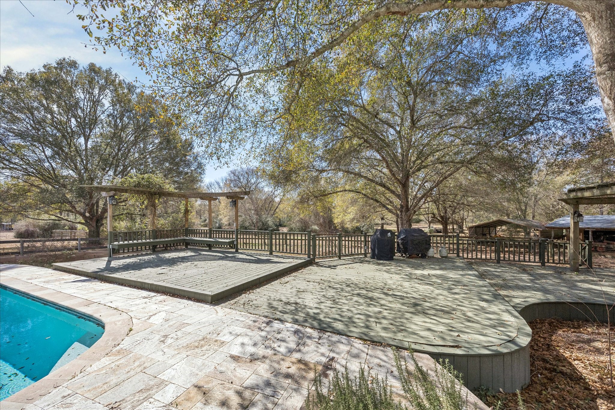 640 Piney Creek Road Bellville, TX 77418 - Photo 25 of 31 Entertain with ease on the large deck overlooking the pool.