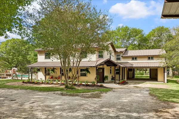 a view of a swimming pool with a yard