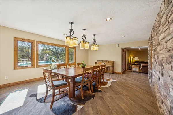 a living room with furniture ceiling fan and a flat screen tv
