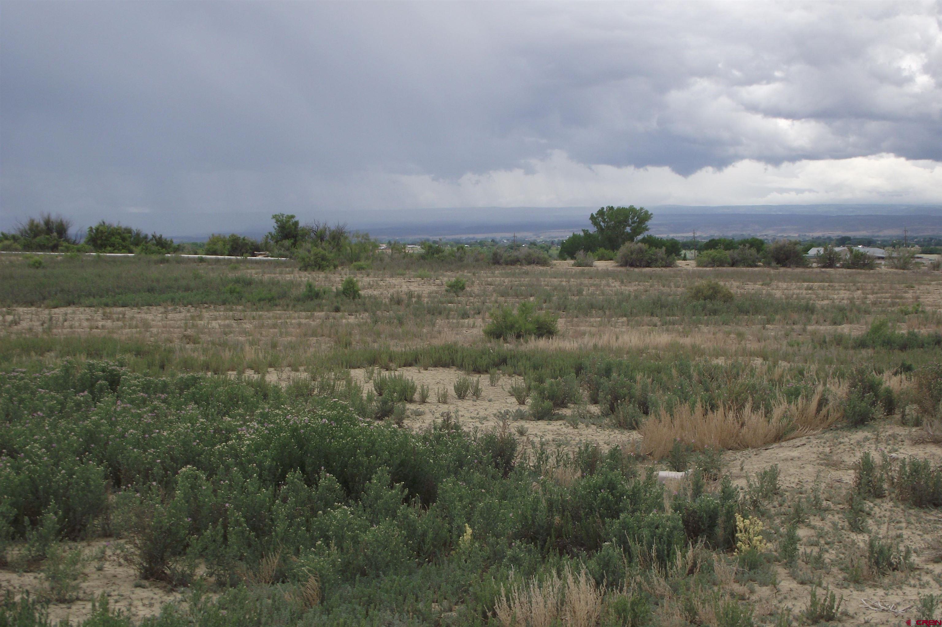 Lot 1-tbd Lot 1-tbd 1900th Road Delta, CO 81416 - Photo 29 of 31 a view of a lake and green valley