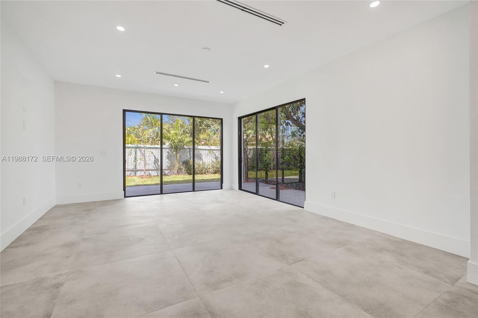 2421 Southwest 16th Terrace Miami, FL 33145 - Photo 11 of 37 a view of an empty room with a window