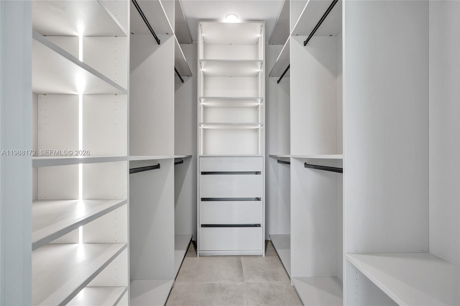 2421 Southwest 16th Terrace Miami, FL 33145 - Photo 16 of 37 a view of walk in closet with empty racks