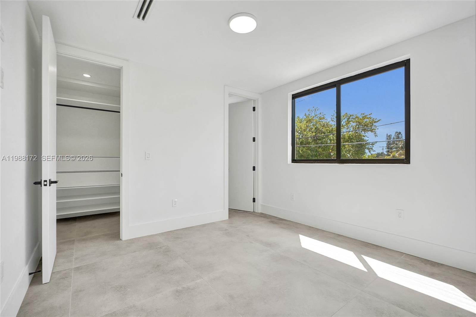 2421 Southwest 16th Terrace Miami, FL 33145 - Photo 21 of 37 a view of an empty room with a window