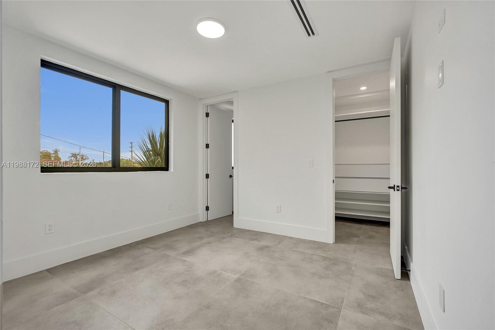 2421 Southwest 16th Terrace Miami, FL 33145 - Photo 24 of 37 a view of an empty room with a window