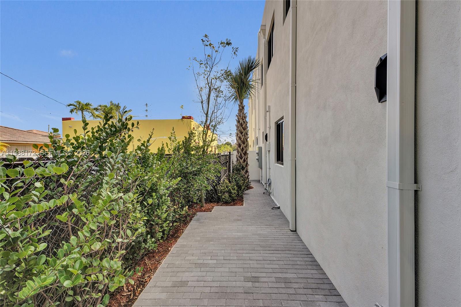 2421 Southwest 16th Terrace Miami, FL 33145 - Photo 28 of 37 a view of a pathway of a house with a yard