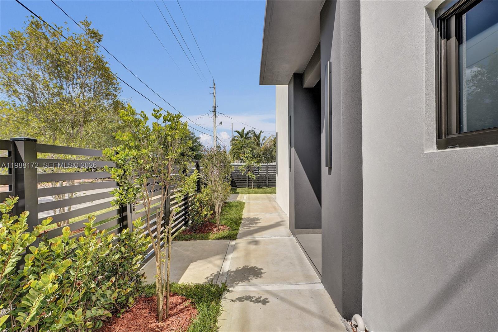 2421 Southwest 16th Terrace Miami, FL 33145 - Photo 32 of 37 a view of a pathway both side of house