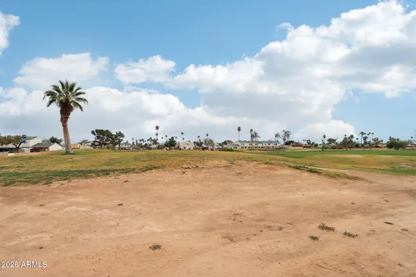 a view of a swimming pool with a lounge chairs