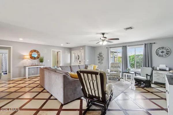 a view of a dining room with furniture and chandelier