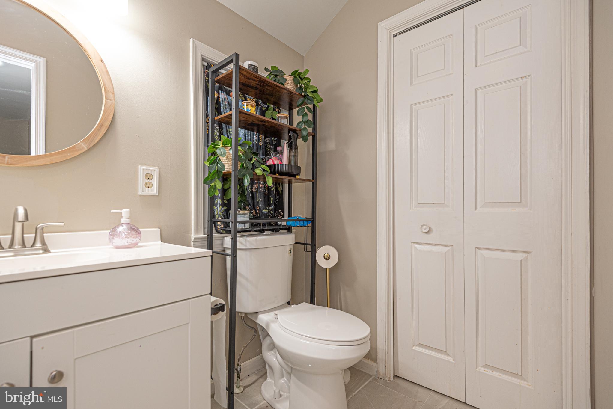 33 Liberty Street Ocean Pines, MD 21811 - Photo 19 of 30 a bathroom with a toilet sink and mirror