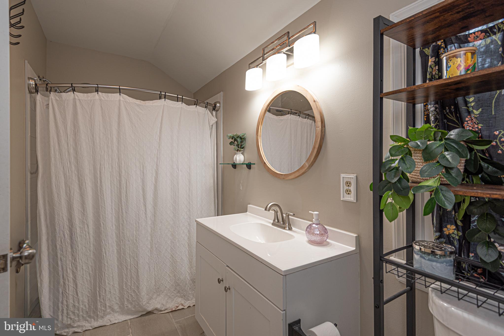 33 Liberty Street Ocean Pines, MD 21811 - Photo 20 of 30 a bathroom with a sink toilet and a mirror