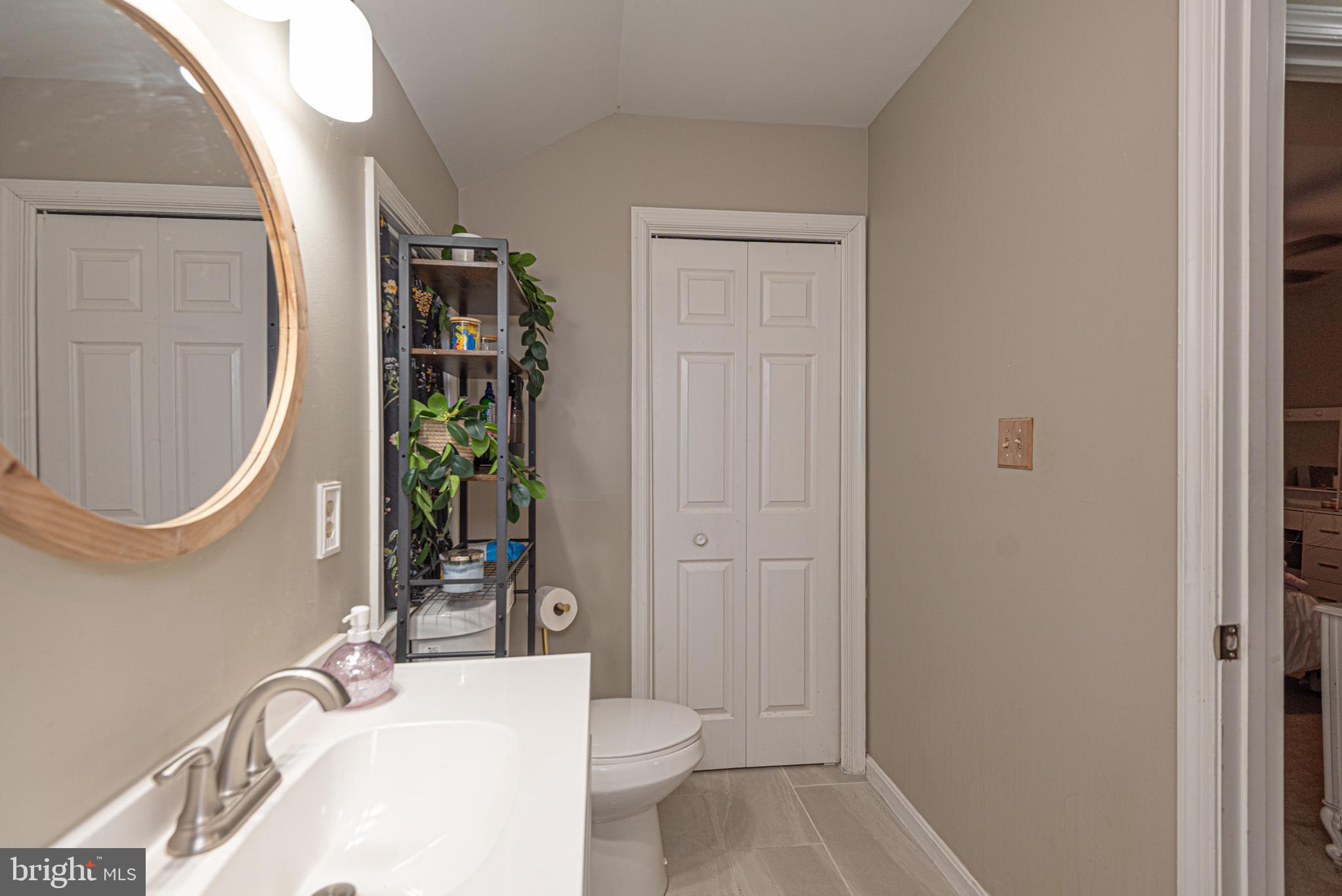 33 Liberty Street Ocean Pines, MD 21811 - Photo 21 of 30 a bathroom with a granite countertop sink a toilet and shower