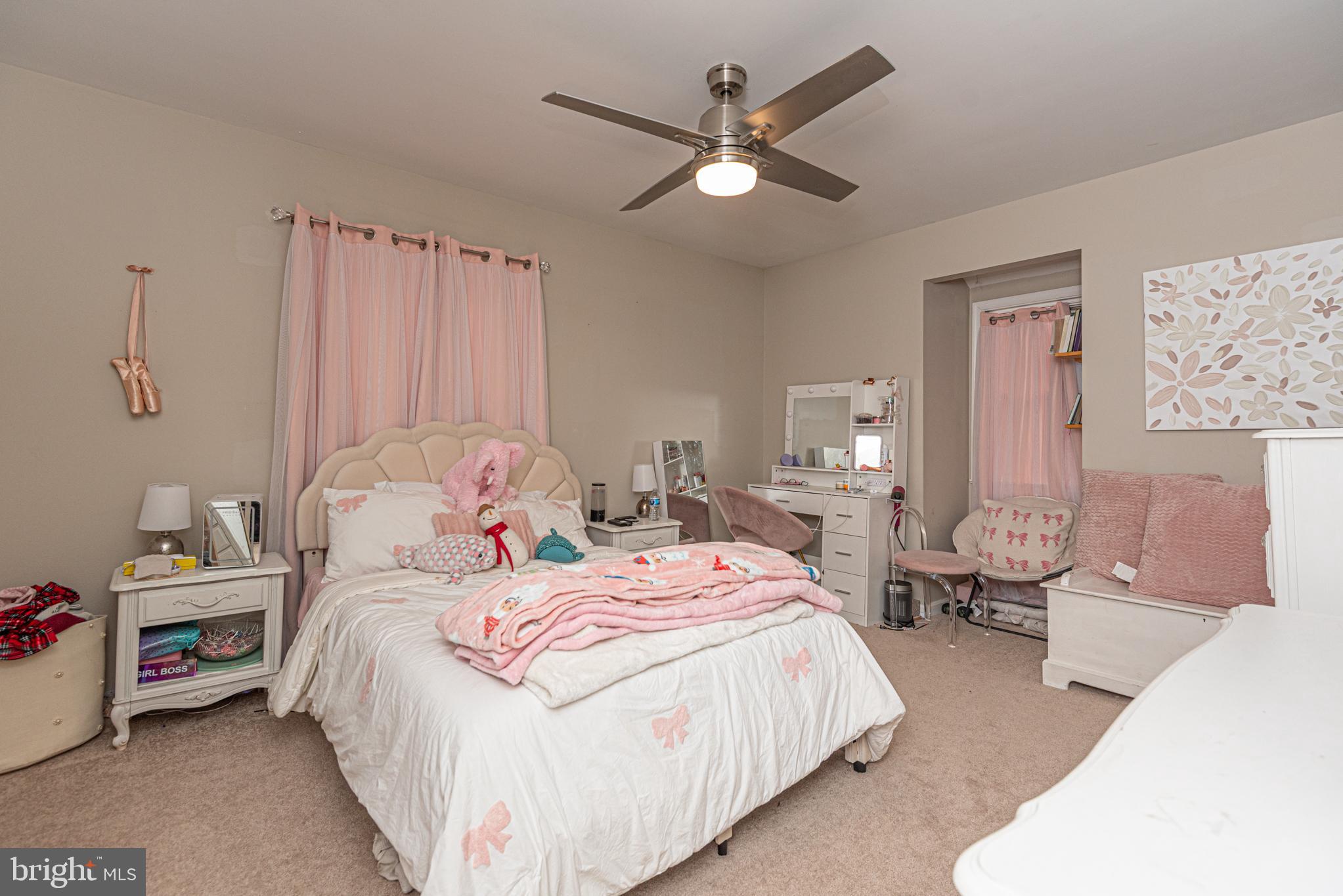 33 Liberty Street Ocean Pines, MD 21811 - Photo 22 of 30 a bedroom with double bed and a chandelier