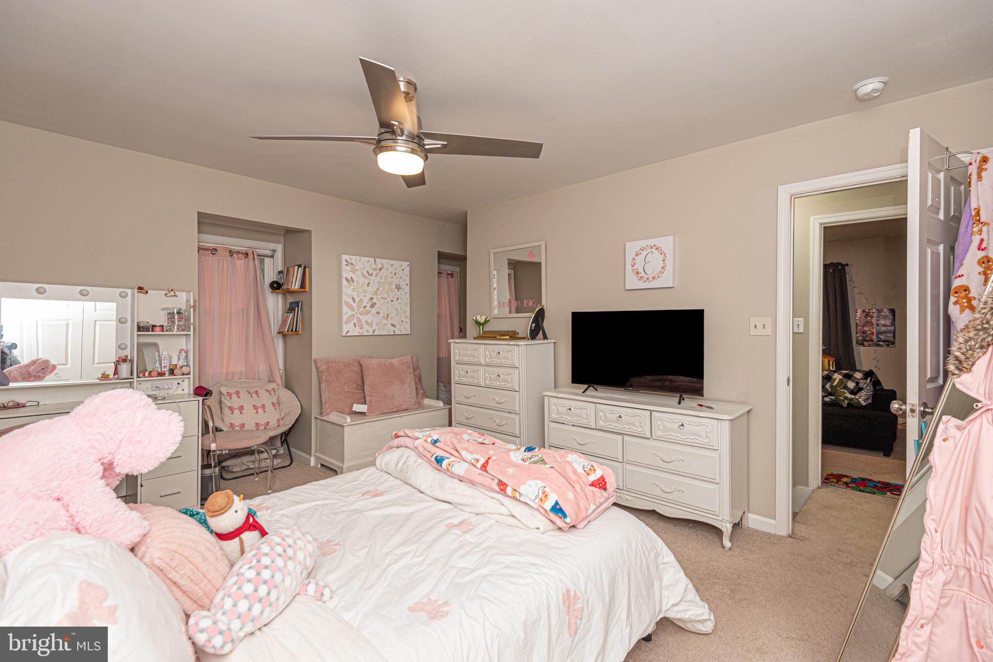33 Liberty Street Ocean Pines, MD 21811 - Photo 23 of 30 a bedroom with a bed and a flat screen tv