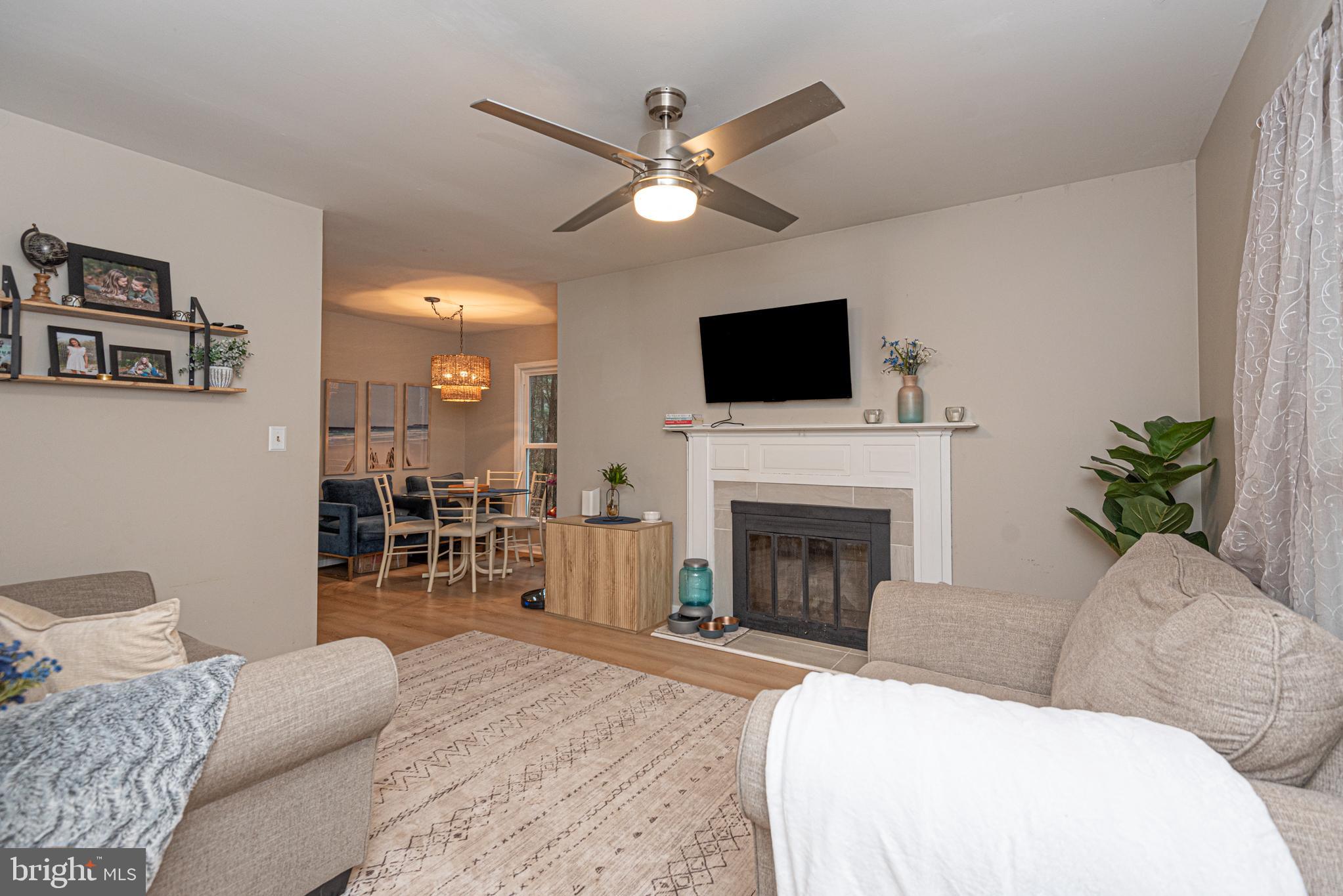 33 Liberty Street Ocean Pines, MD 21811 - Photo 6 of 30 a living room with furniture a fireplace and a flat screen tv
