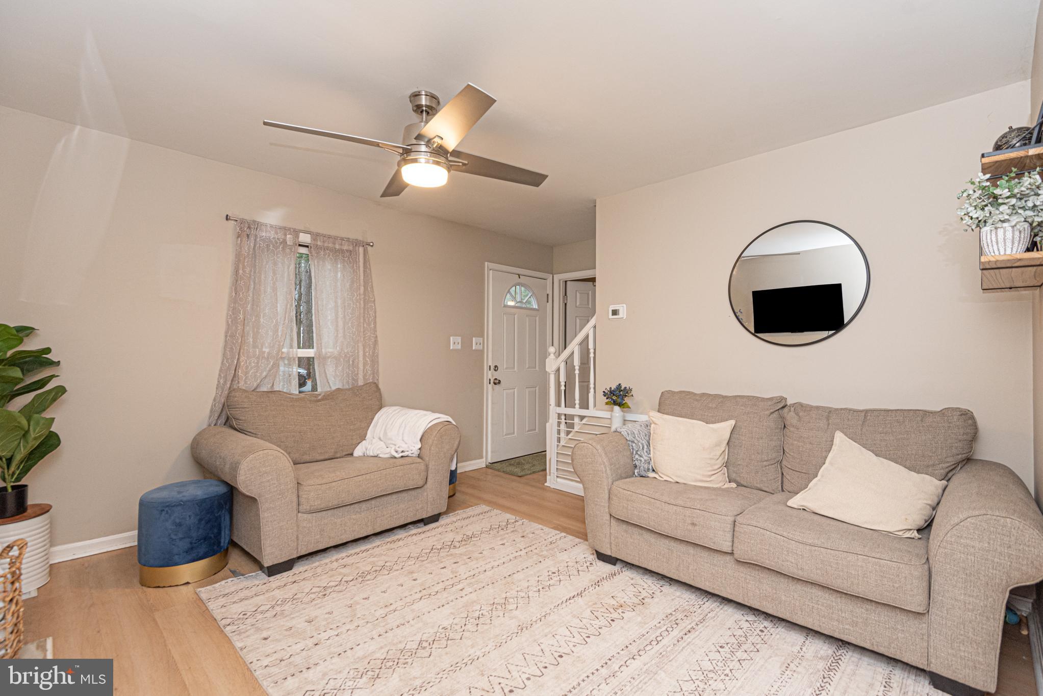 33 Liberty Street Ocean Pines, MD 21811 - Photo 8 of 30 a living room with furniture and a fireplace