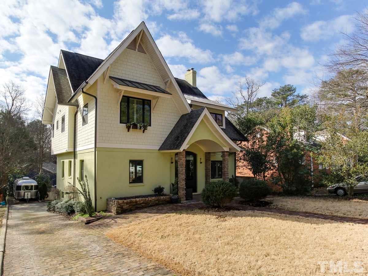 2711 Barmettler Street Raleigh, NC 27607 - Photo 1 of 25 a front view of a house with a yard