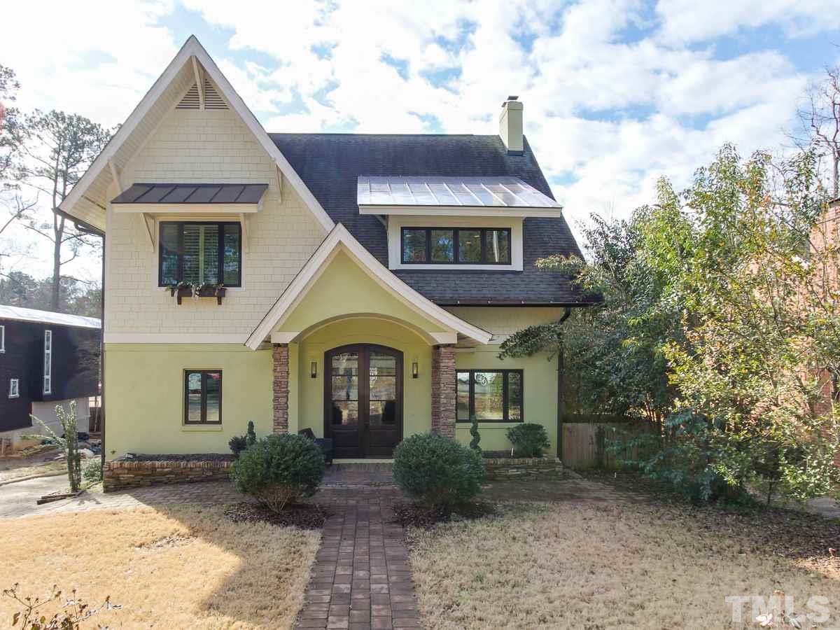 2711 Barmettler Street Raleigh, NC 27607 - Photo 2 of 25 a front view of a house with garden