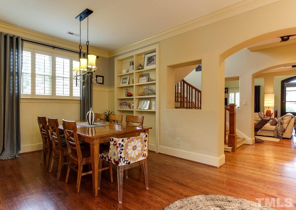 2711 Barmettler Street Raleigh, NC 27607 - Photo 12 of 25 a view of a dining room with furniture window and wooden floor
